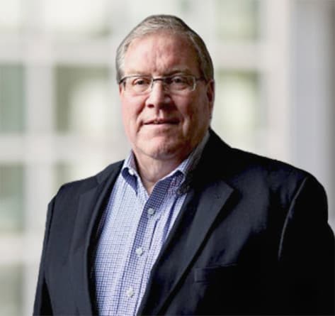 Headshot of Thomas Harrington.